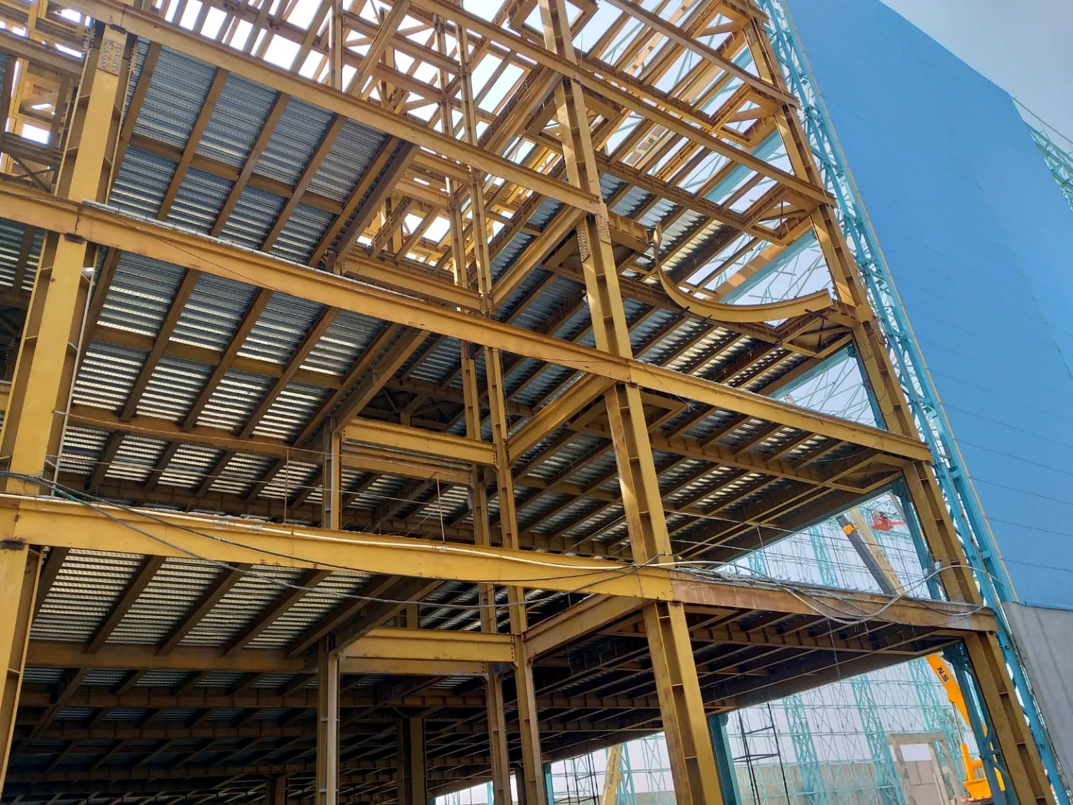 Multi-storey structural steel frame with metal deck flooring and roof framing.