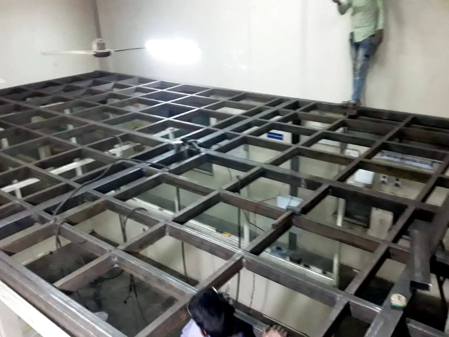 Dense steel grid frame for mezzanine or elevated floor construction.