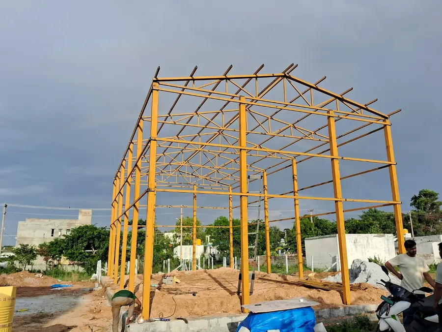 Yellow-painted steel frame installed for a structural project.